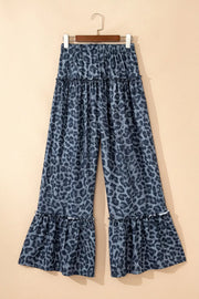 Maternity wide-leg pants in dark navy with leopard print and ruffled hems.