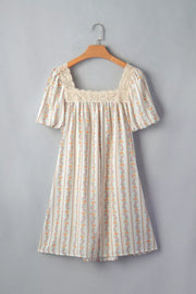 Floral mini dress with lace trim, square neck, short puff sleeves, and vertical floral stripe pattern.