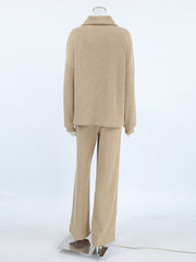 Beige cowl-neck turtleneck and wide-leg pants set with ribbed texture.