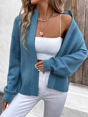 French Blue ribbed acrylic zip-up sweater with a stand-up collar and full zip closure.