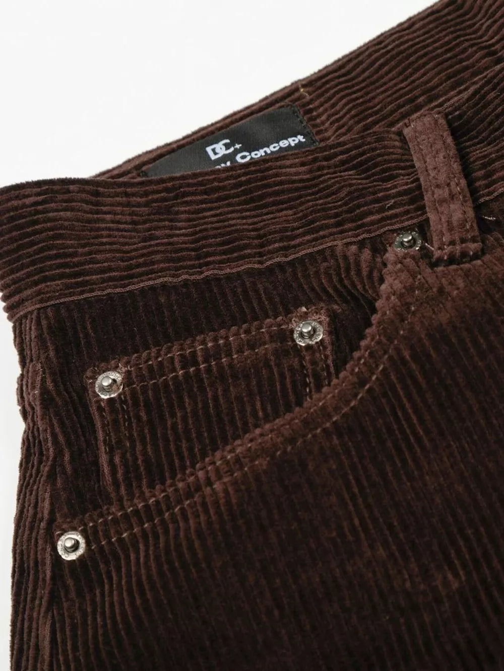 Brown corduroy wide-leg joggers with button fly and silver rivets on pockets.