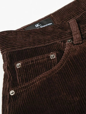 Brown corduroy wide-leg joggers with button fly and silver rivets on pockets.