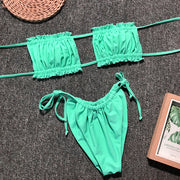 Neon green ruffle bandeau bikini set with tie-side bottoms