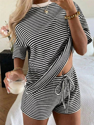 Black and white striped two-piece set with drawstring shorts and short sleeve top.