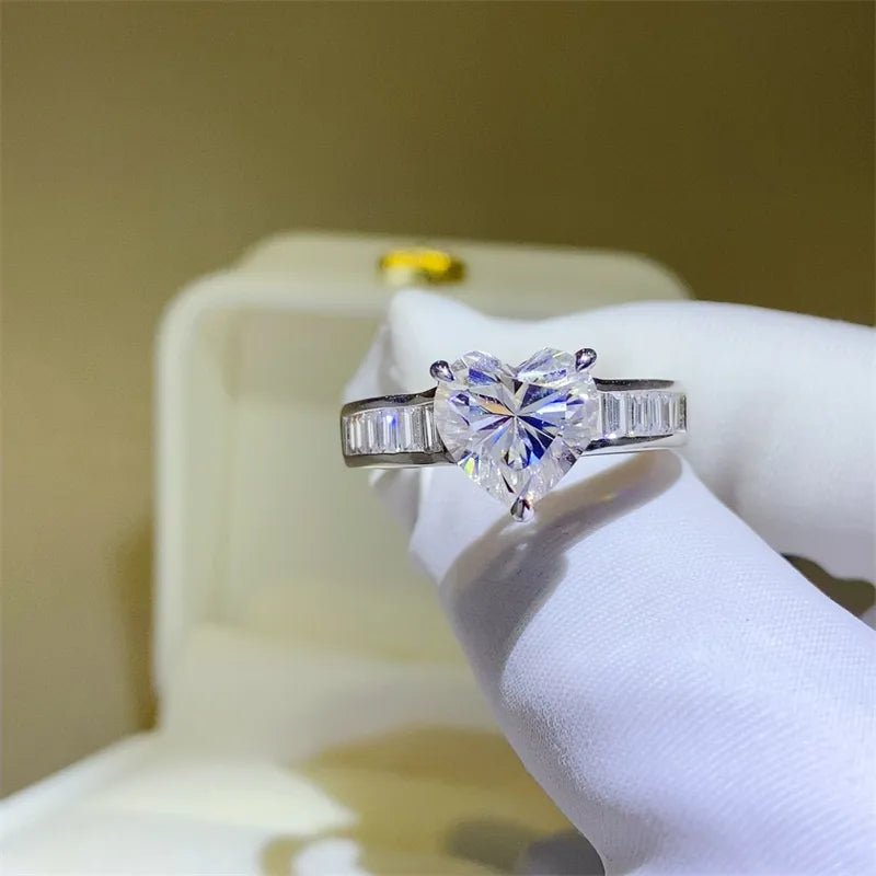 Silver heart-cut moissanite ring with baguette band