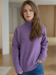 Purple ribbed turtleneck sweater with subtle sparkle details and ribbed cuffs.