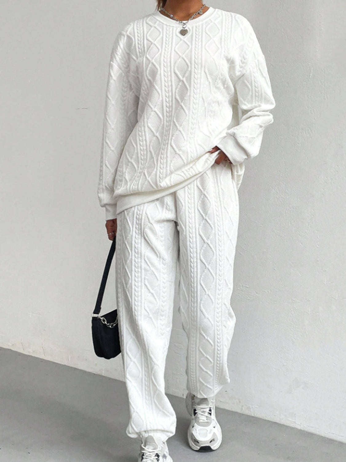White cable knit loungewear set with crew neck sweatshirt and cuffed pants