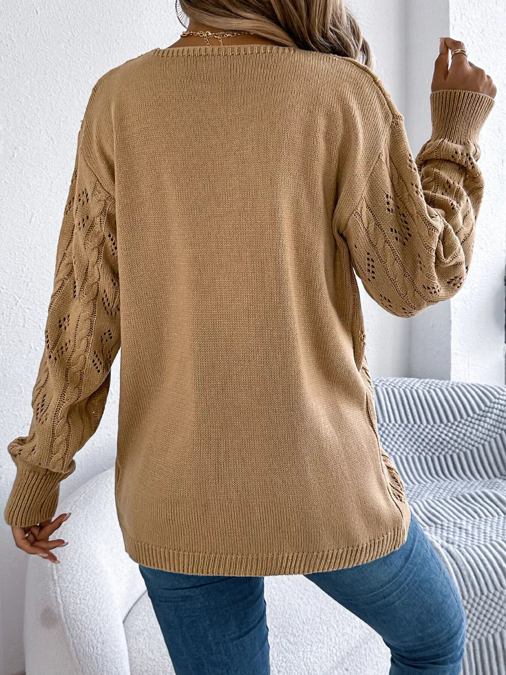 Khaki acrylic openwork long sleeve cardigan with cable knit detail on sleeves.