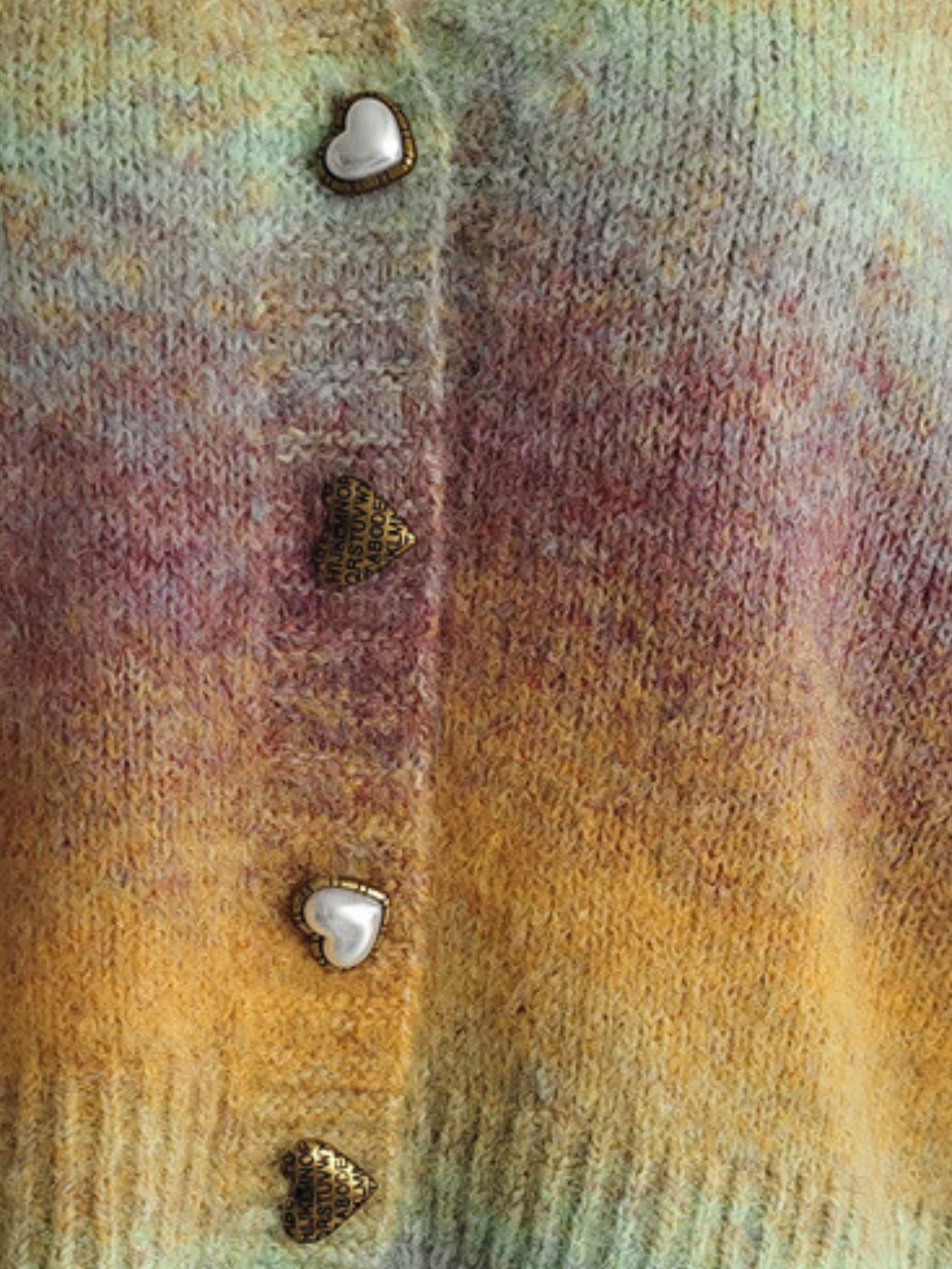 Ombre knit cardigan with heart buttons and textured acrylic blend.