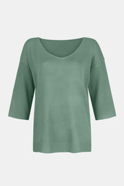 Flared sleeve V-neck knit sweater in Gum Leaf with ribbed sleeves.
