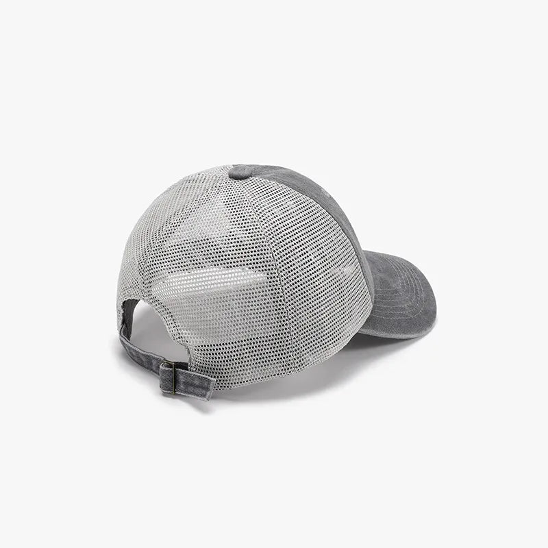 Gray vintage wash trucker hat with mesh back and adjustable strap