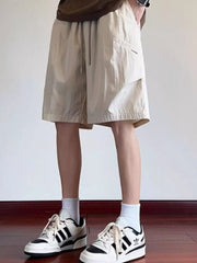 Men's beige relaxed fit drawstring shorts with pockets