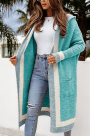 Color-blocked hooded knit maxi cardigan in Tiffany Blue with white and gray stripes, featuring pockets.