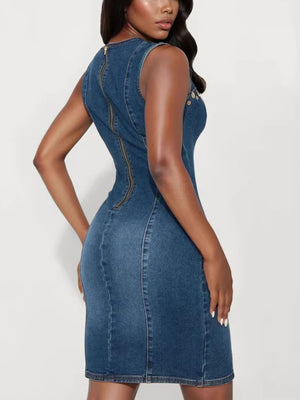 Embellished denim bodycon dress with back zipper and cutout details.