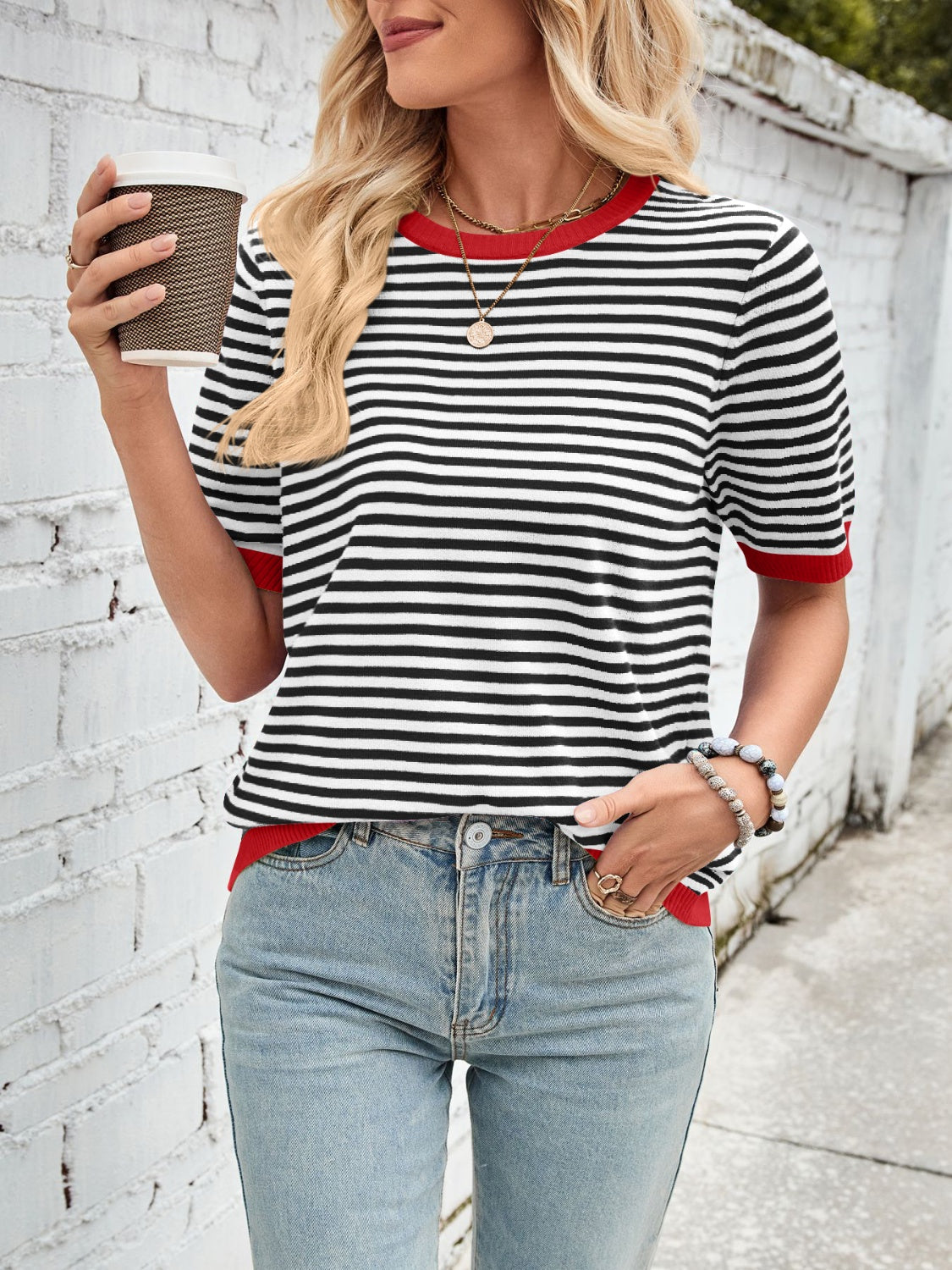 Nautical striped knit tee with red trim and short sleeves.