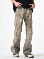 Loose-fit men's distressed jeans in faded grey wash, 100% cotton, with ripped details.