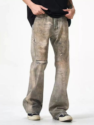 Loose-fit men's distressed jeans in faded grey wash, 100% cotton, with ripped details.