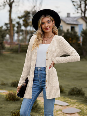 Longline ribbed knit button-down cardigan in beige with pockets and a relaxed fit.