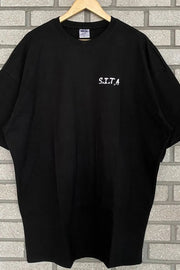 Black oversized t-shirt with white S.I.T.A. text graphic on chest