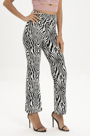 Zebra print flared leg trousers with a high waist.