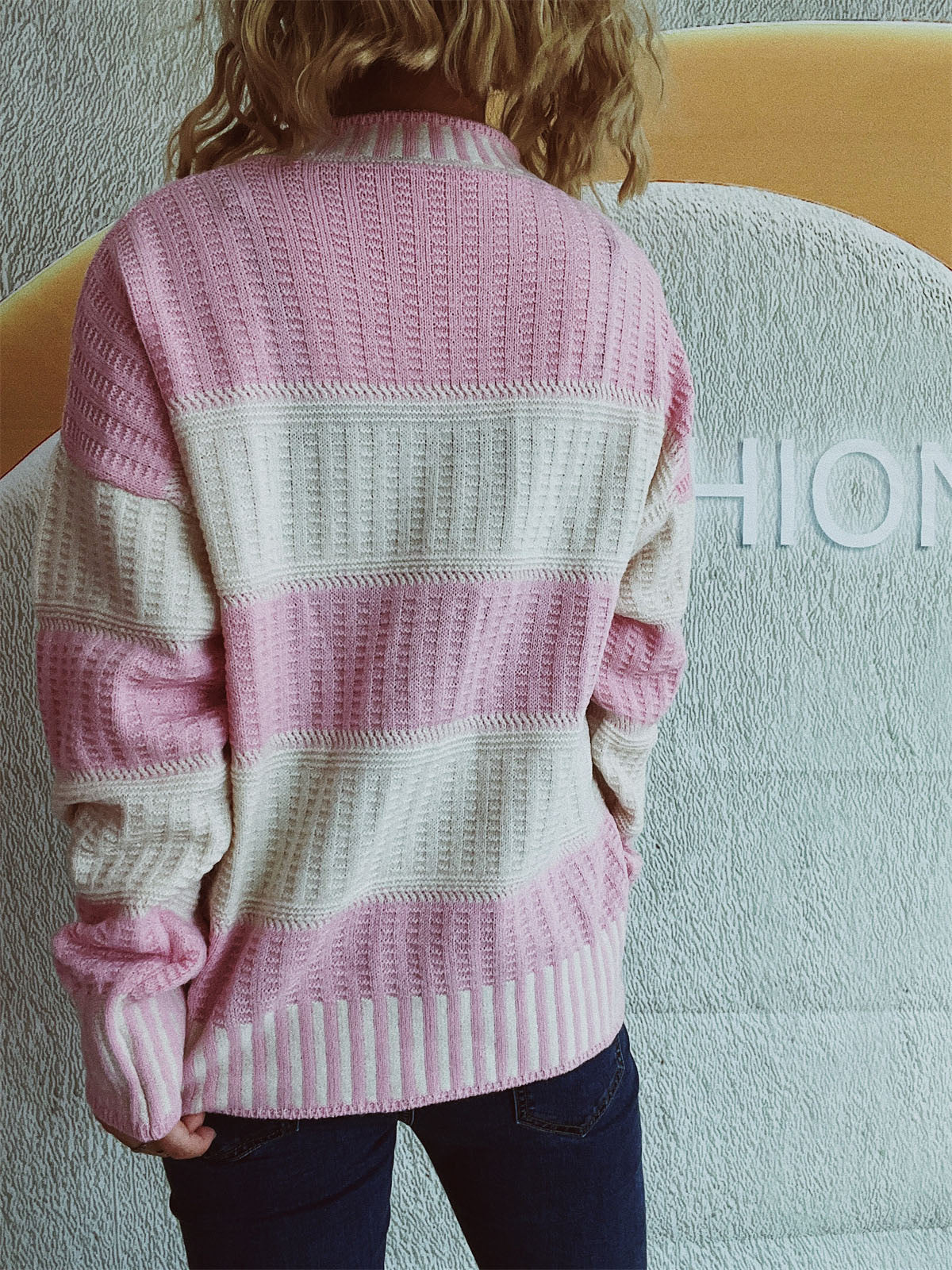 Textured stripe mock neck knit sweater in blush pink and cream acrylic with a waffle knit pattern.
