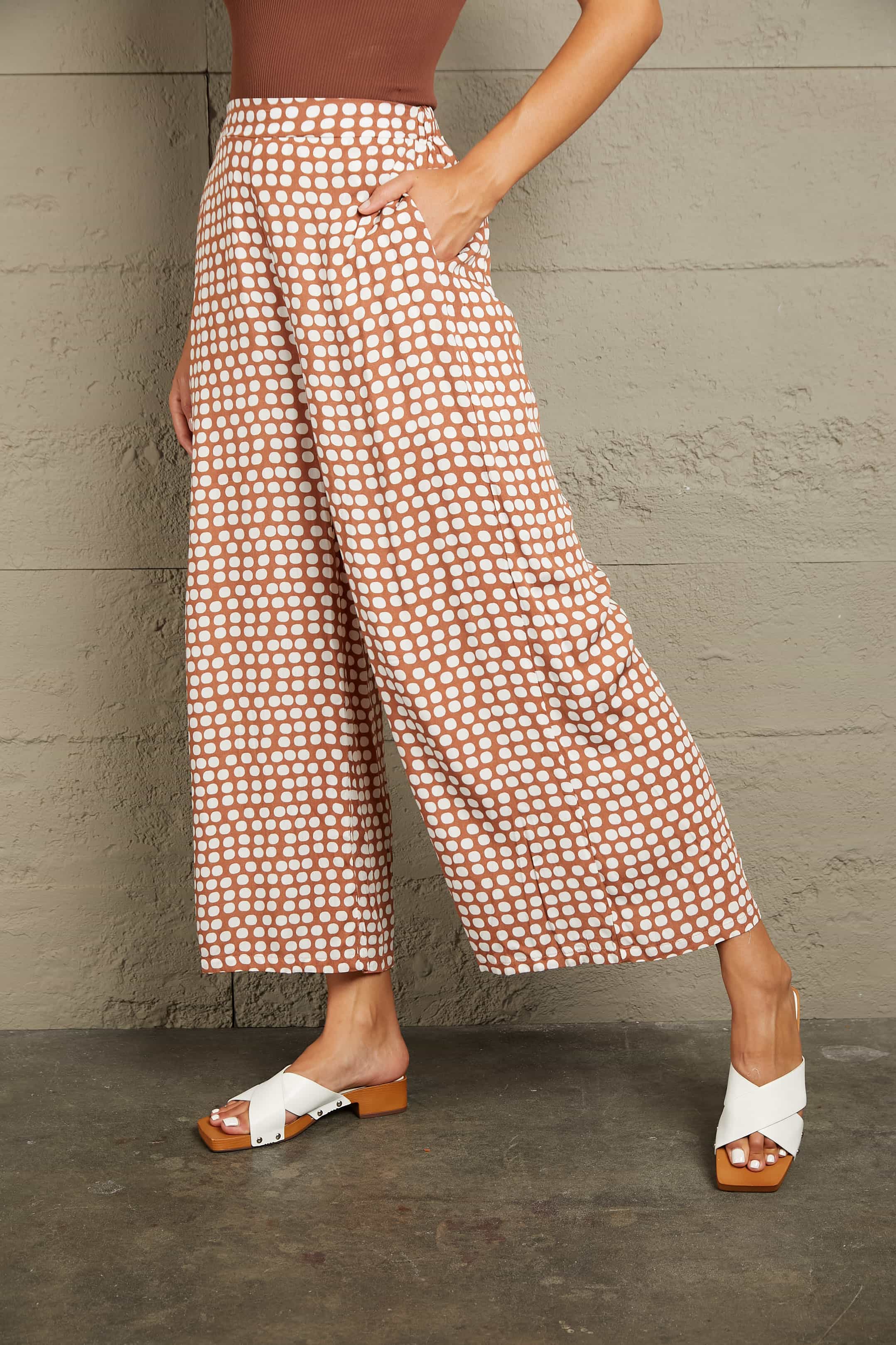 Polka dot wide leg culottes in dusty pink with pockets.