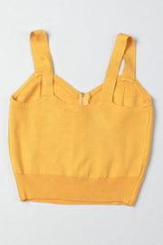 Gold ribbed knit crop top with exposed zipper and wide straps.