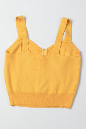 Gold ribbed knit crop top with exposed zipper and wide straps.