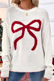 White acrylic knit sweater with a large red bow graphic and contrast stitching.