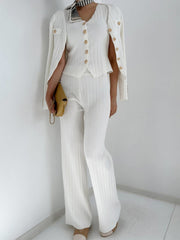 White ribbed knit outfit set with gold buttons, featuring a cardigan, V-neck top, and wide-leg pants.
