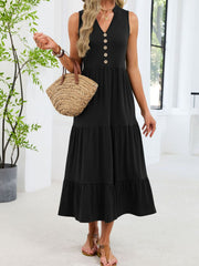 Black tiered midi dress with V-neck and decorative buttons, sleeveless.