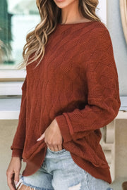 Rust textured diamond knit sweater with relaxed fit and crew neck.