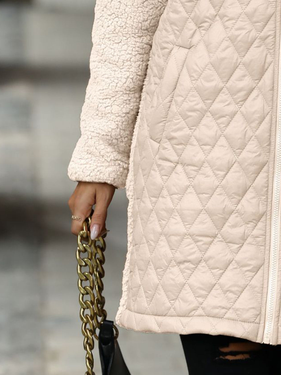 Eggshell teddy and quilted hybrid coat with sherpa sleeves and diamond quilting detail.