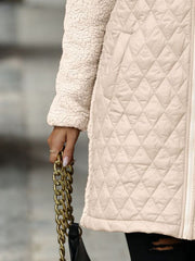 Eggshell teddy and quilted hybrid coat with sherpa sleeves and diamond quilting detail.