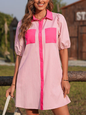 Button-down mini dress in pink and white stripe cotton with puff sleeves and contrast pink pockets.