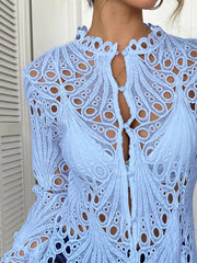 Blue lace button-up blouse with scalloped collar and intricate cutout pattern.