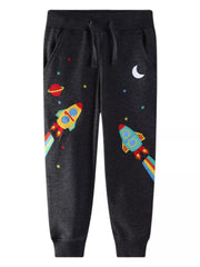 Black embroidered rocket joggers for kids with planets and stars.