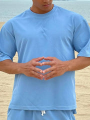 Sky blue oversized cotton tee with drop shoulder and crew neck.