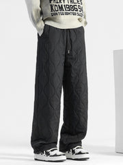 Men's black quilted sweatpants with relaxed fit and drawstring waist.