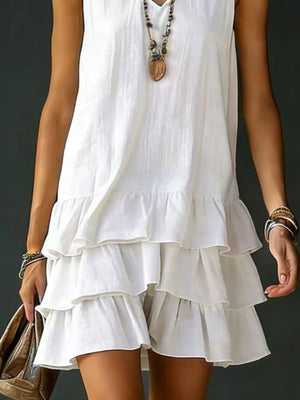 White tiered ruffled hem v-neck dress with airy, casual style.
