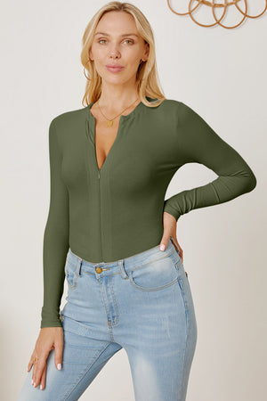 Ribbed long sleeve bodysuit in Matcha Green with a zip plunge neckline.