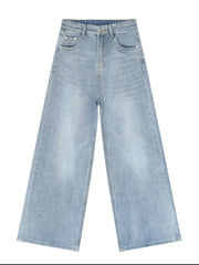 Light blue denim palazzo trousers with a wide leg and buttoned fly.