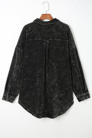Black textured corduroy overshirt with faded wash and button details.