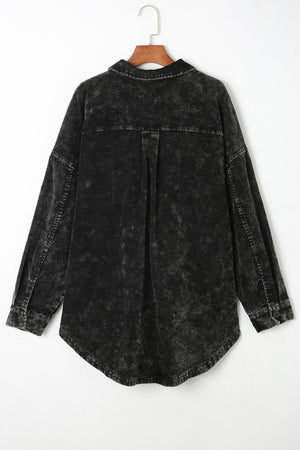 Black textured corduroy overshirt with faded wash and button details.