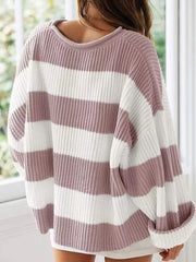 Striped oversized knit sweater in dusty pink and white with a crew neck and cuffed sleeves.