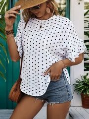White polka dot blouse with ruffled sleeves and a keyhole neckline.