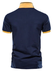 Navy polo shirt with yellow collar and sleeve trim, short sleeves, casual style.