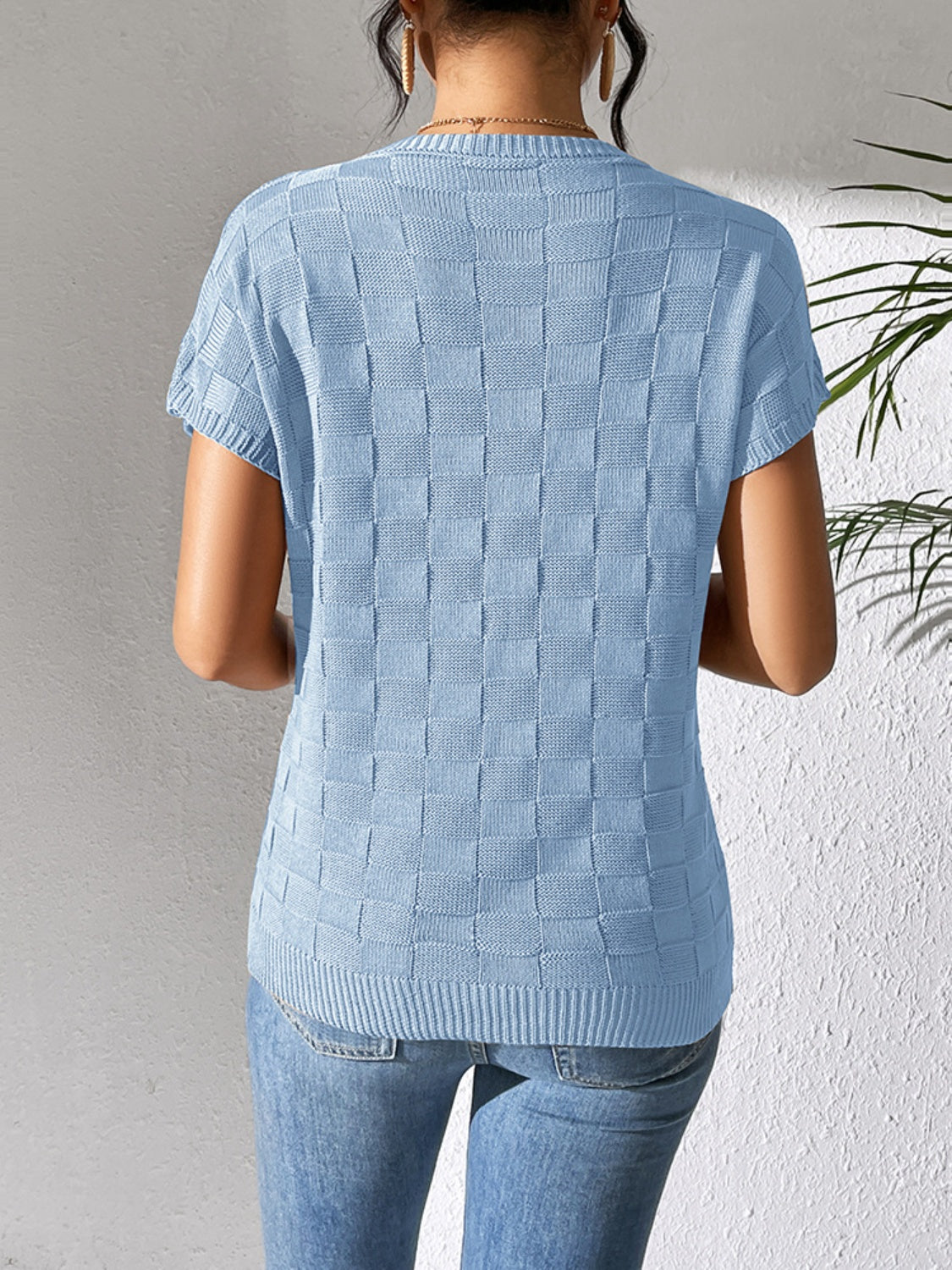 Light blue textured check knit pocket tee with short sleeves and crew neck.