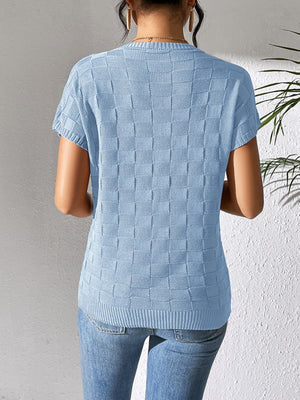 Light blue textured check knit pocket tee with short sleeves and crew neck.
