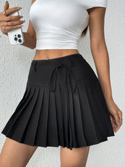 Black pleated mini skirt with tie-waist detail